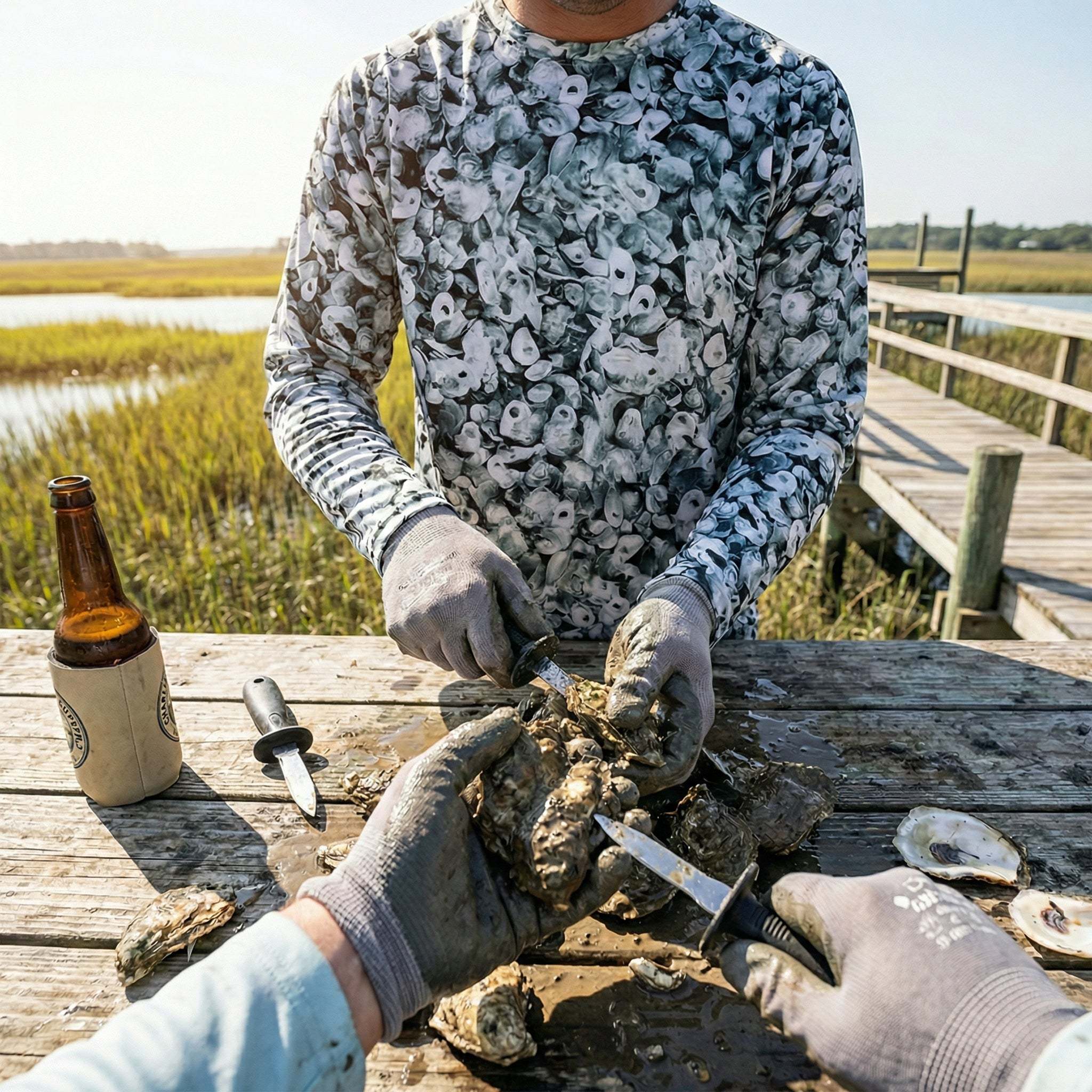 Backyard oyster roast setup with steaming oysters, shucking station, and shell disposal bins
