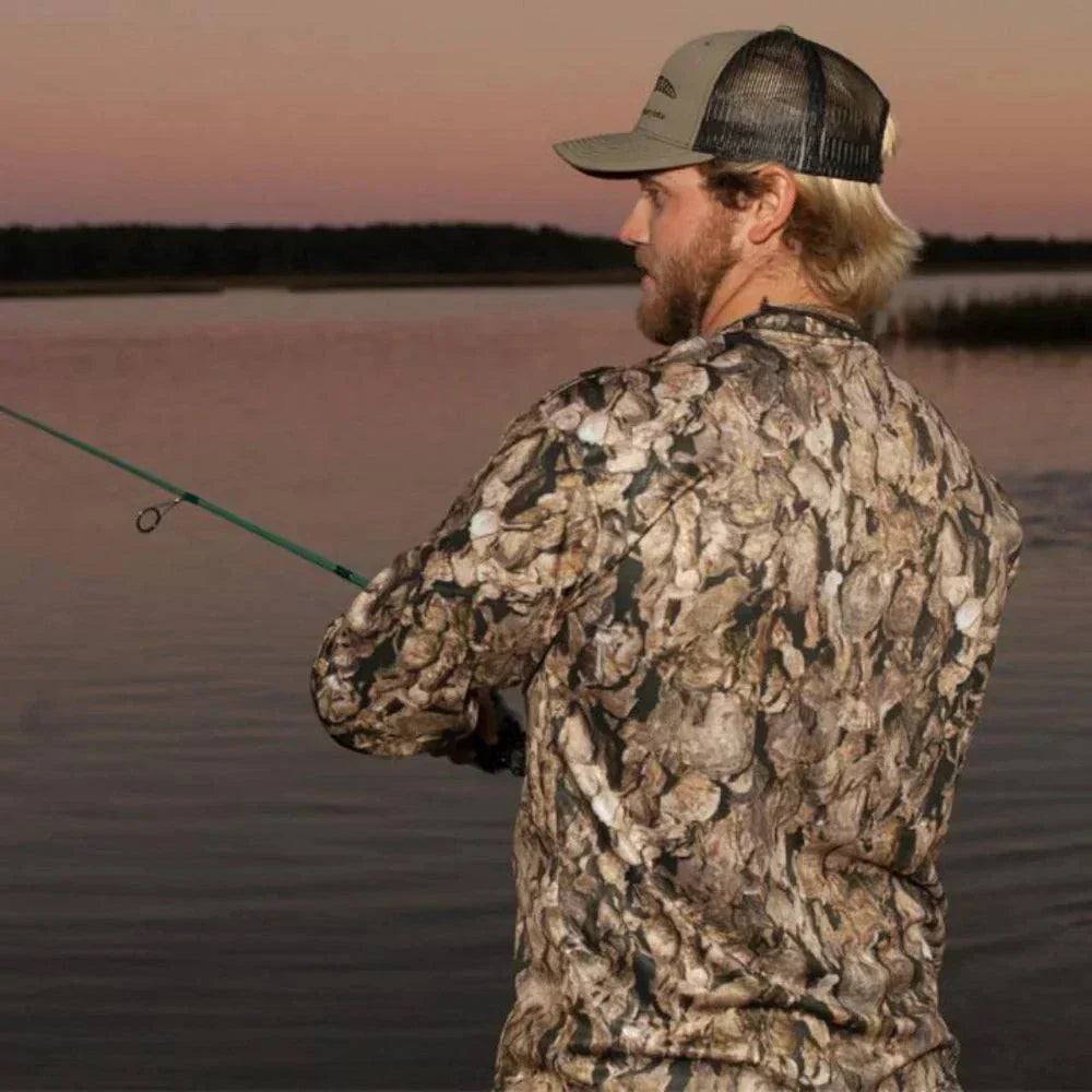 Oystaflage camo shirt worn by a local at an oyster roast showing coastal camouflage for comfort and practicality