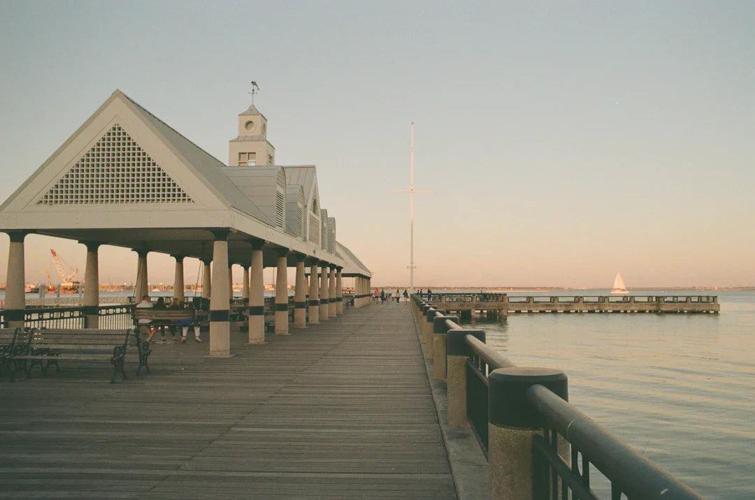 Historic Charleston waterfront with colorful Rainbow Row houses and harbor view